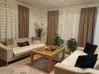 a living room with a couch and a coffee table at Apartman Amy Visoko in Visoko