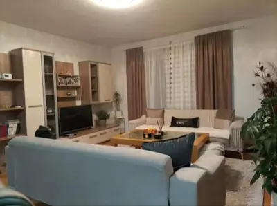 a living room with a couch and a table at Apartman Amy Visoko in Visoko