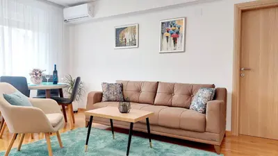 a living room with a couch and a table at Banjaluka Centar1 in Banja Luka
