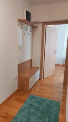 a room with a mirror and a green rug at Banjaluka Centar1 in Banja Luka
