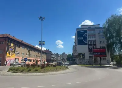 an empty street in a city with buildings at Apartment Esmihan in Tuzla