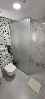 a bathroom with a toilet and a shower at VAL apartmani in Jajce