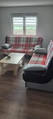 a living room with a couch and a coffee table at Apartmani Donji Vakuf in Donji Vakuf