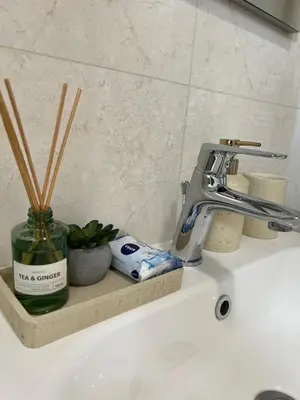 a bathroom sink with a faucet on a counter at Apartmani Pervan in Livno