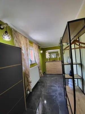 a room with a bunk bed and a room with a ladder at Villa Amy in Bihać