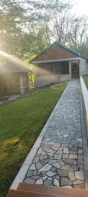 a stone walkway in front of a house at Weekend house Mali Raj in Visoko
