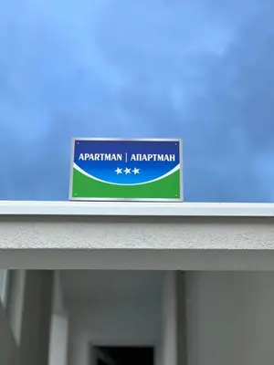 a sign for an australian airport sitting on a shelf at Apartman TEA in Željeznička Stanica Bosanski Šamac