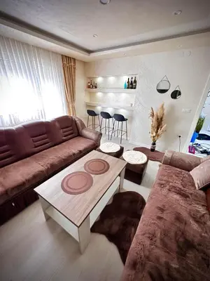 a living room with a couch and a coffee table at Apartman TEA in Željeznička Stanica Bosanski Šamac