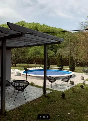 a pavilion with chairs and a swimming pool at Vikendica Niki - Village house with pool in Ćetojevići