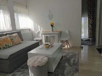 a living room with a couch and a coffee table at Apartman Nera in Gradačac