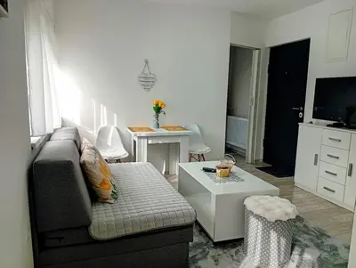 a living room with a couch and a table at Apartman Nera in Gradačac
