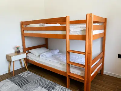 a couple of bunk beds in a room at UNA Escape in Glodina