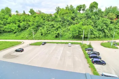 an aerial view of a parking lot with cars at Apartman Slani San in Tuzla