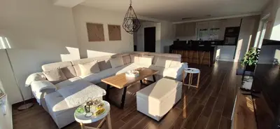 a living room with a couch and a table at Villa Alyanna in Rankovići