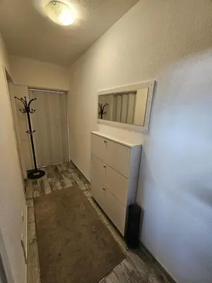 a room with a dresser and a mirror on the wall at Apartman Annie in Bihać