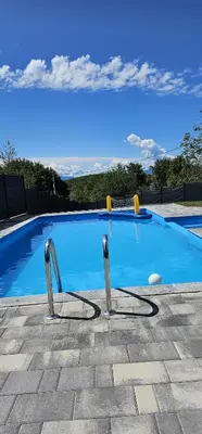 a large swimming pool with a clear blue at Villa Vienna in Bužim
