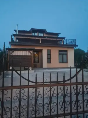 a house with a fence in front of it at Apartman Dar in Bihać