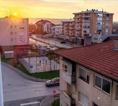 a view of a city with a street and buildings at Apartman VIP in Modriča
