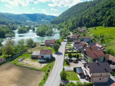 an aerial view of a village next to a river at Villa Plavno in Otoka