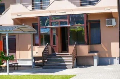a house with a staircase in front of it at Villa Plavno in Otoka