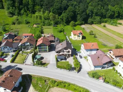 an aerial view of a village with houses and a road at Villa Plavno in Otoka