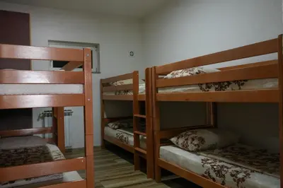 a room with three bunk beds in a room at Villa Plavno in Otoka