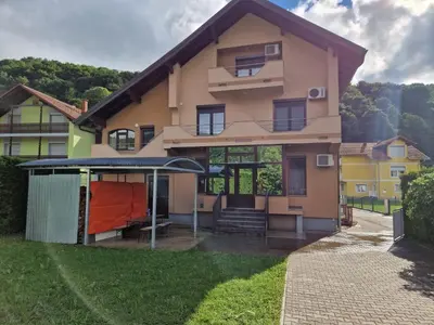a house with a gazebo in front of it at Villa Plavno in Otoka