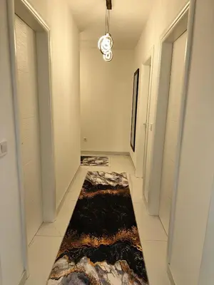 a hallway with a rug on the floor at Stan Tesanj in Tešanj