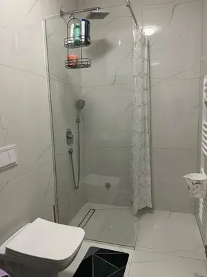 a bathroom with a shower and a toilet at Stan Tesanj in Tešanj