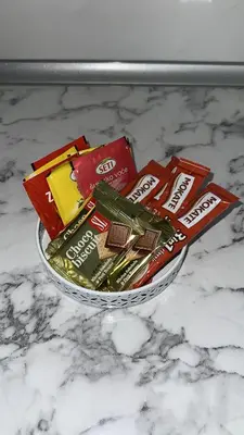 a bowl of chocolate bars on a counter at Stan Tesanj in Tešanj