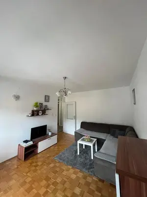 a living room with a couch and a tv at Apartman Filip in Jajce
