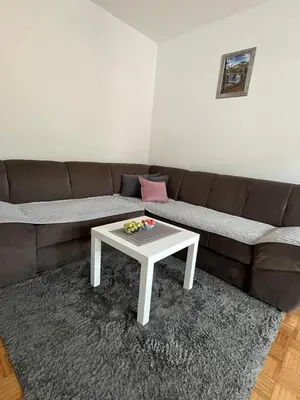 a living room with a couch and a table at Apartman Filip in Jajce