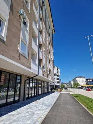 an empty sidewalk in front of a building at Apartman Eden in Doboj