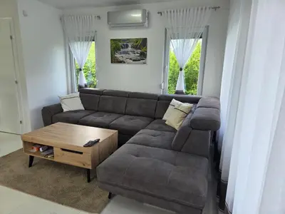 a living room with a couch and a coffee table at Villa Alisa in Bihać