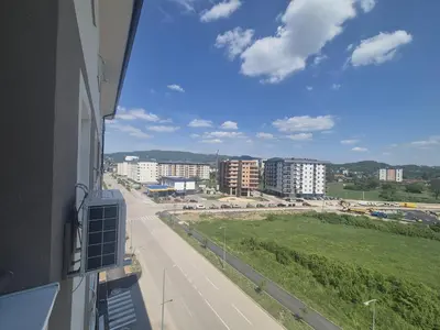 a view from a balcony of a street and buildings at Apartman Centar 8 Doboj in Doboj