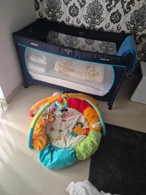 a childs play room with a bunk bed and a crib at Apartman IN in Bihać