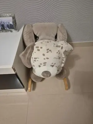 a stuffed elephant sitting in a corner of a room at Apartman IN in Bihać
