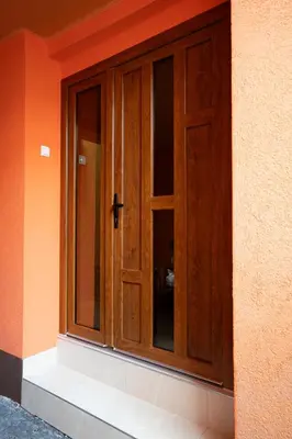 a wooden door on the side of a building at Apartman Elyca in Visoko