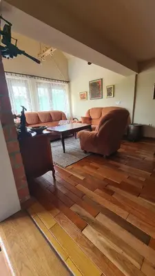 a living room with a couch and a table at Vikendica Mala Priča in Srebrenik