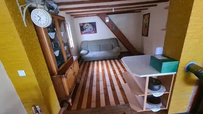 an overhead view of a living room with a couch and a clock at Vikendica Mala Priča in Srebrenik
