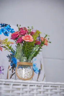 a vase filled with flowers sitting on a shelf at A Cozy Nest in Teslic in Teslić