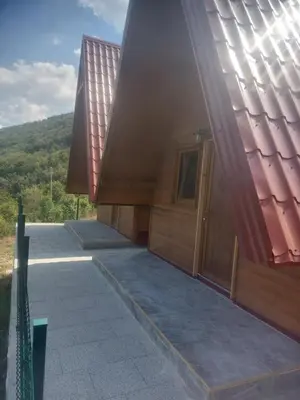 a building with a door on the side of it at Bungalovi Potočarska panorama in Mrkonjić Grad