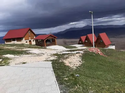 a group of buildings on top of a hill at Bungalovi Potočarska panorama in Mrkonjić Grad