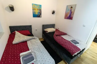 two beds sitting next to each other in a room at Guest House Lejla 2 in Travnik