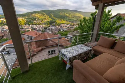 a balcony with a view of a city at Guest House Lejla 2 in Travnik