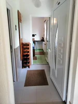 a hallway with a door leading to a room at Domaćinstvo Una-Ostrovica in Kulen Vakuf