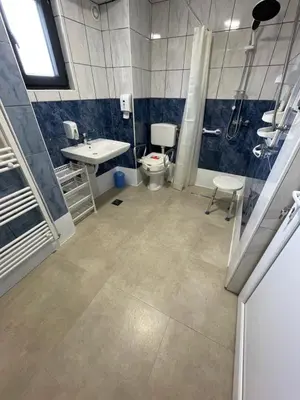 a bathroom with a toilet and a sink and a shower at Domaćinstvo Una-Ostrovica in Kulen Vakuf