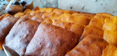 a close up of a loaf of bread with a spoon at HOTEL Pyramid Lodge in Visoko