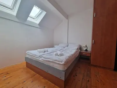 a bedroom with a bed with two towels on it at Apartman Sofija 2 in Banja Luka