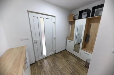 an empty room with a door and a wooden floor at Holiday Residence Šehić in Visoko